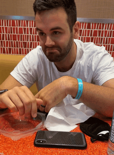 a man wearing a blue wristband that says i love you