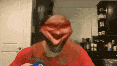 a man in a red shirt with a pepsi logo on the front of his shirt