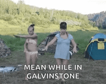 two women in bikinis are dancing in a field with the words mean while in galvinstone .