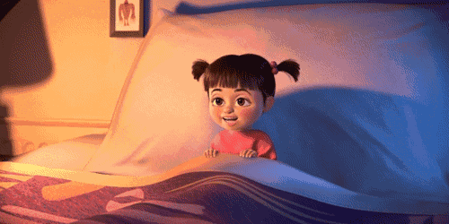 boo from monsters inc is laying in bed
