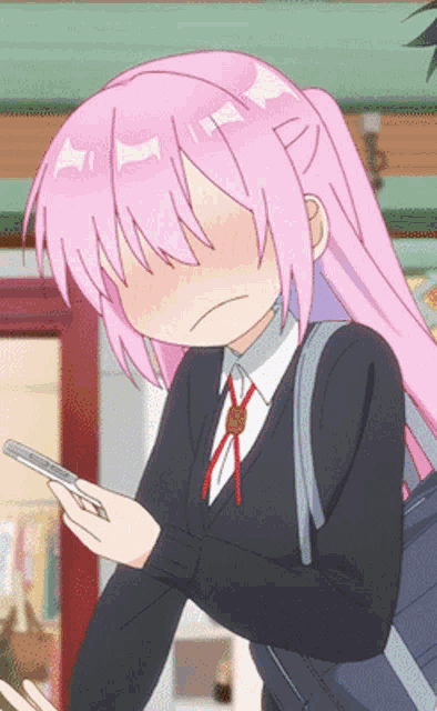 a girl with pink hair is holding a cell phone in her hand