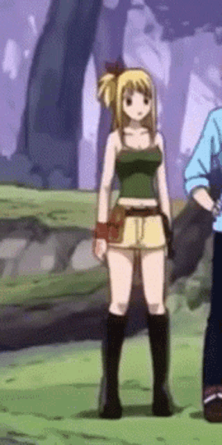 a girl in a green tank top and shorts is standing next to a man