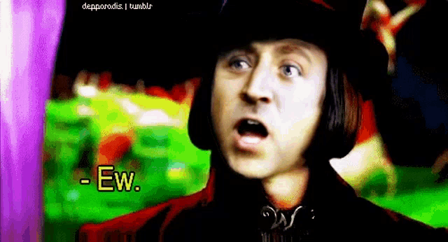 a man wearing a top hat is making a funny face and saying `` ew '' .