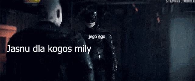 a man holding a megaphone with the words " jasnu dla kogos mily " written on it