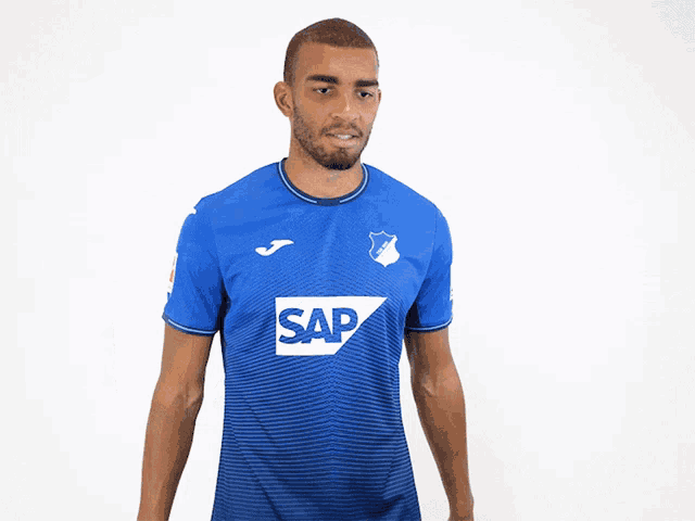 a man in a blue shirt with the word sap on the front