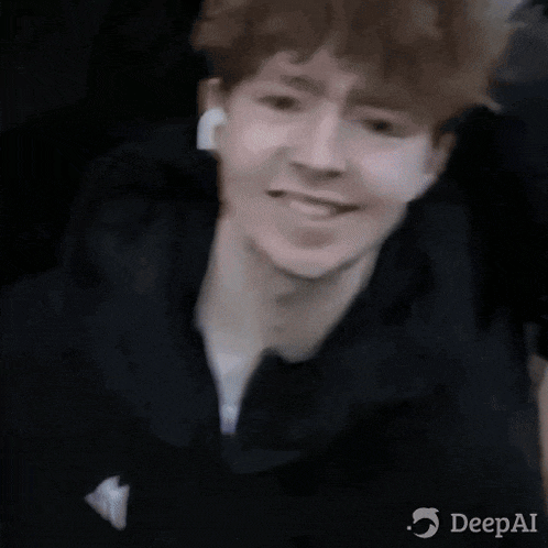 a close up of a person 's face with a blurred background and the words deepai on the bottom .