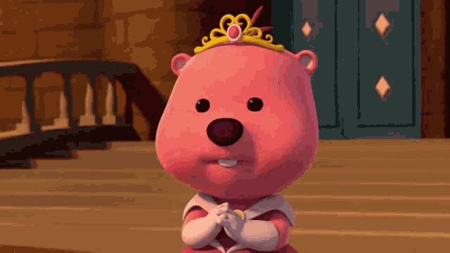 a pink teddy bear wearing a tiara and a pink dress