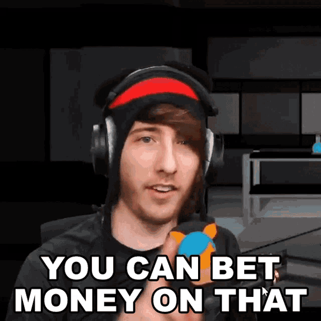 a man wearing headphones and a beanie says you can bet money on that