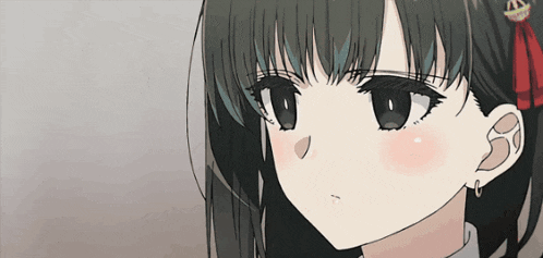 a close up of a girl 's face with a crown on her hair