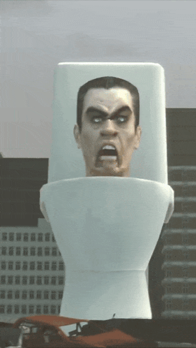 a giant toilet with a man 's head on it
