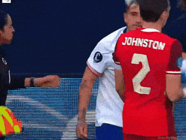 a man in a red jersey with the number 2 on it