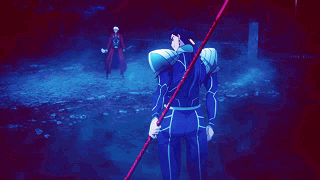 a blue light is shining on a person in a dark area