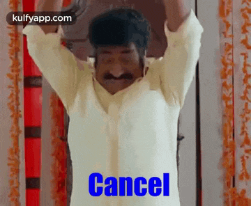 a man with a mustache is holding his arms up in the air and the word cancel is written on the screen .