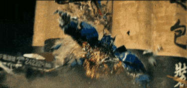 a person in a blue suit is flying through the air in front of a building with chinese writing on it