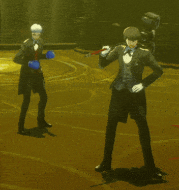 a man in a tuxedo and boxing gloves is standing next to another man