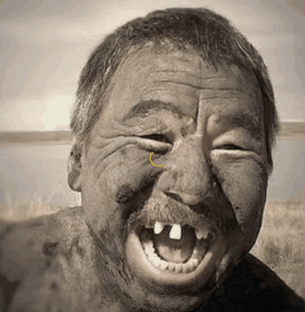 a close up of a man 's face with a smiley face on it