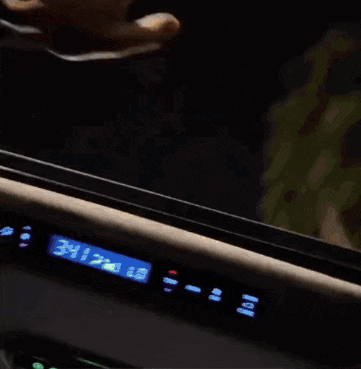 a person 's hands are reaching out to touch a screen that says ' mizu ' on it