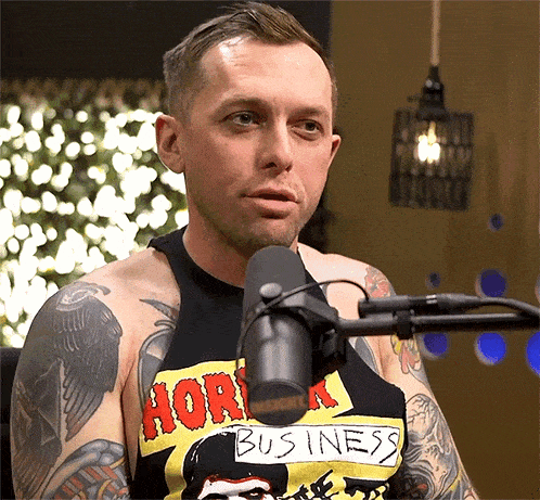a man wearing a shirt that says hork business