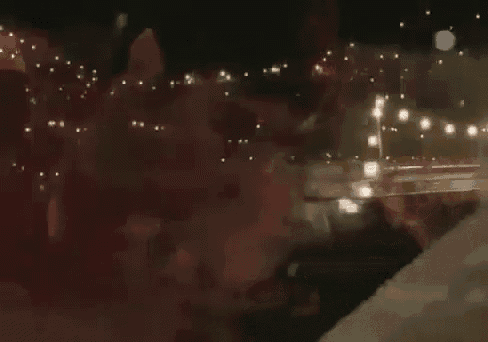 a dark night scene with a lot of lights