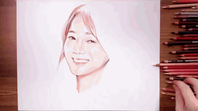 a drawing of a woman 's face with colored pencils on a table