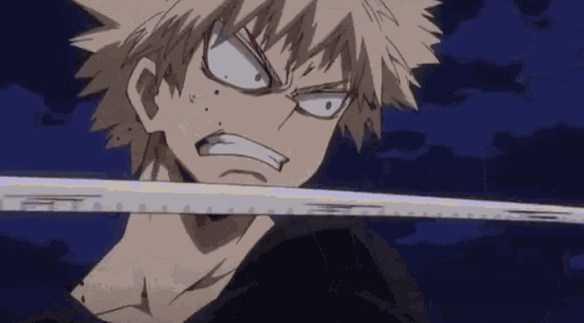 a close up of a person holding a sword with a very angry face .