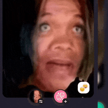 a woman 's face is shown in a video call with two smiley faces on the bottom right