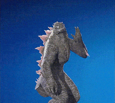 a statue of a monster with a blue background