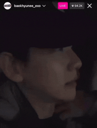 a close up of a person 's face with a live icon above it