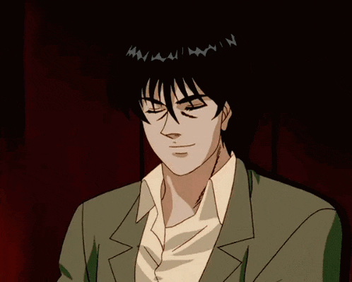 a man wearing sunglasses and a suit is looking at something