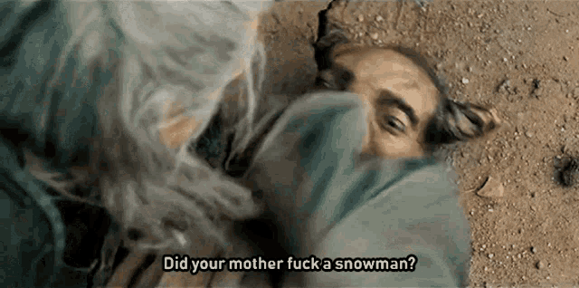a man laying on the ground with the words did your mother fuck a snowman written above him