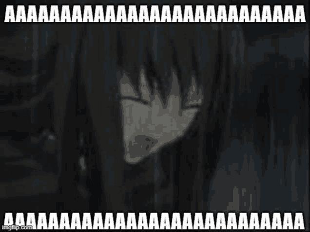 a girl with long black hair is crying and making a funny face with her mouth open .