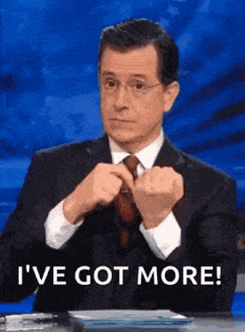 a man in a suit and tie is making a funny face and saying `` i 've got more ''