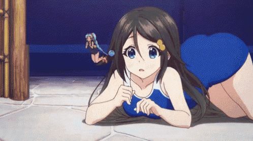a girl in a blue swimsuit is laying on the floor with a bubble wand in her hand .