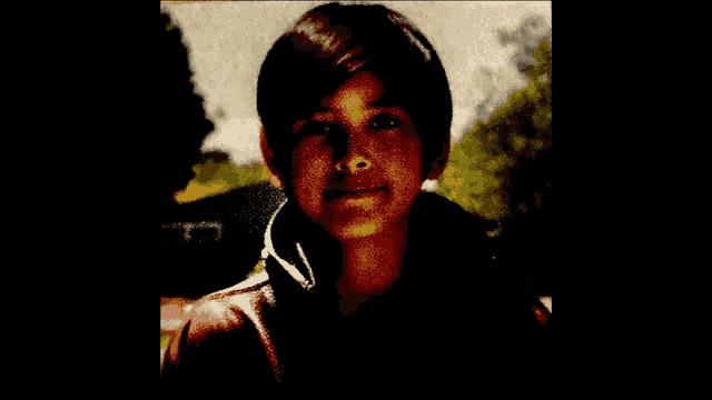a close up of a person 's face with a blurred background