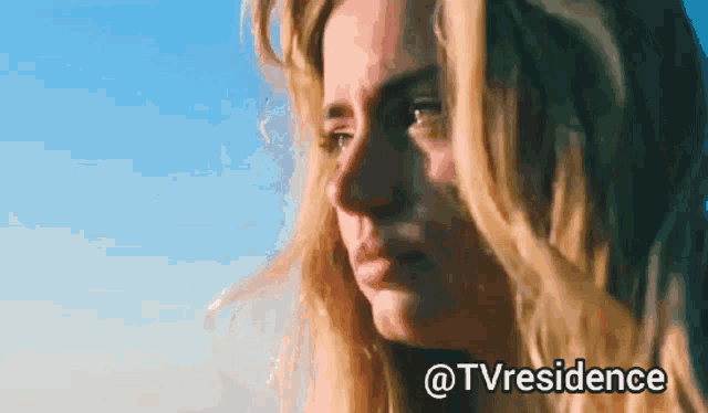 a close up of a woman 's face with the words @tvresidence below