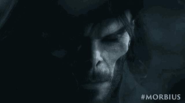 a close up of a man 's face with the hashtag #morbidus below it