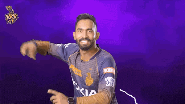 a man with a beard is wearing a jersey that says kkr
