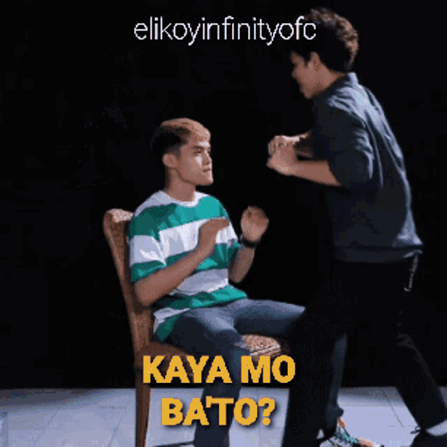 a man in a green and white striped shirt sits in a chair while another man stands next to him and says kaya mo bato