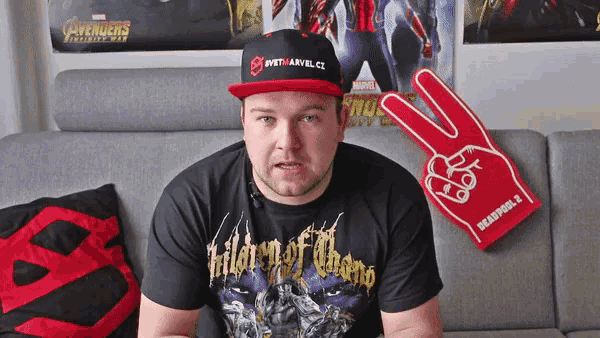 a man wearing a black shirt that says " children of thanos "