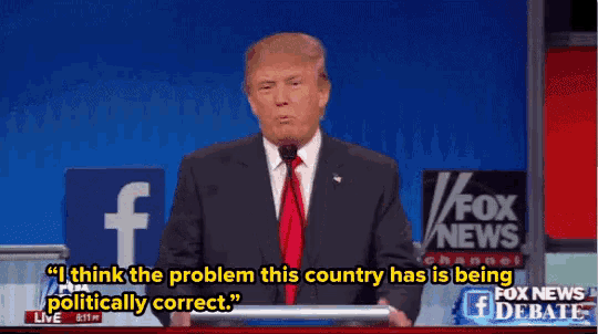 a man in a suit and tie is giving a speech at a podium .