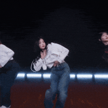 a group of young women are dancing together on a stage
