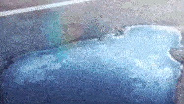 a large ice cube is floating in a swimming pool