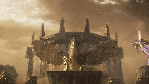 a statue of a bird with wings is in front of a castle