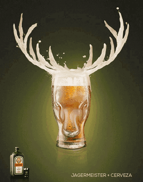 a bottle of jagermeister sits next to a glass