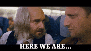 two men on an airplane with the words here we are on the bottom right