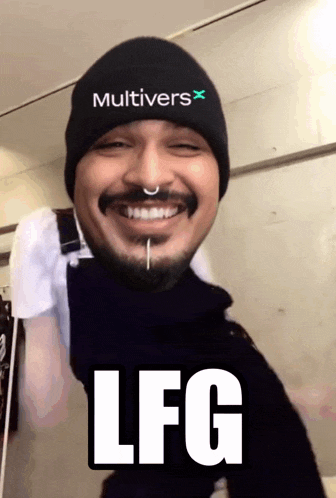 a man wearing a beanie that says multivers x on it