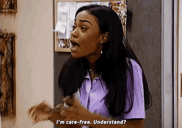 a woman in a purple shirt is saying `` i 'm care-free . understand ? '' .