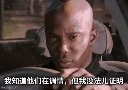 a bald man is driving a car with chinese writing on the side