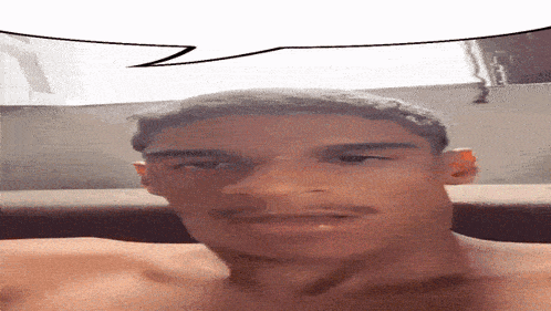 a man without a shirt is smiling with a speech bubble above his head