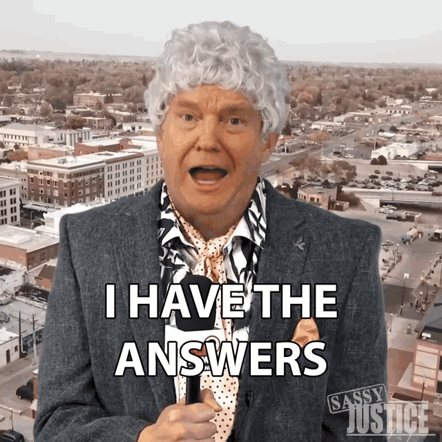 a man in a suit and tie is saying i have the answers
